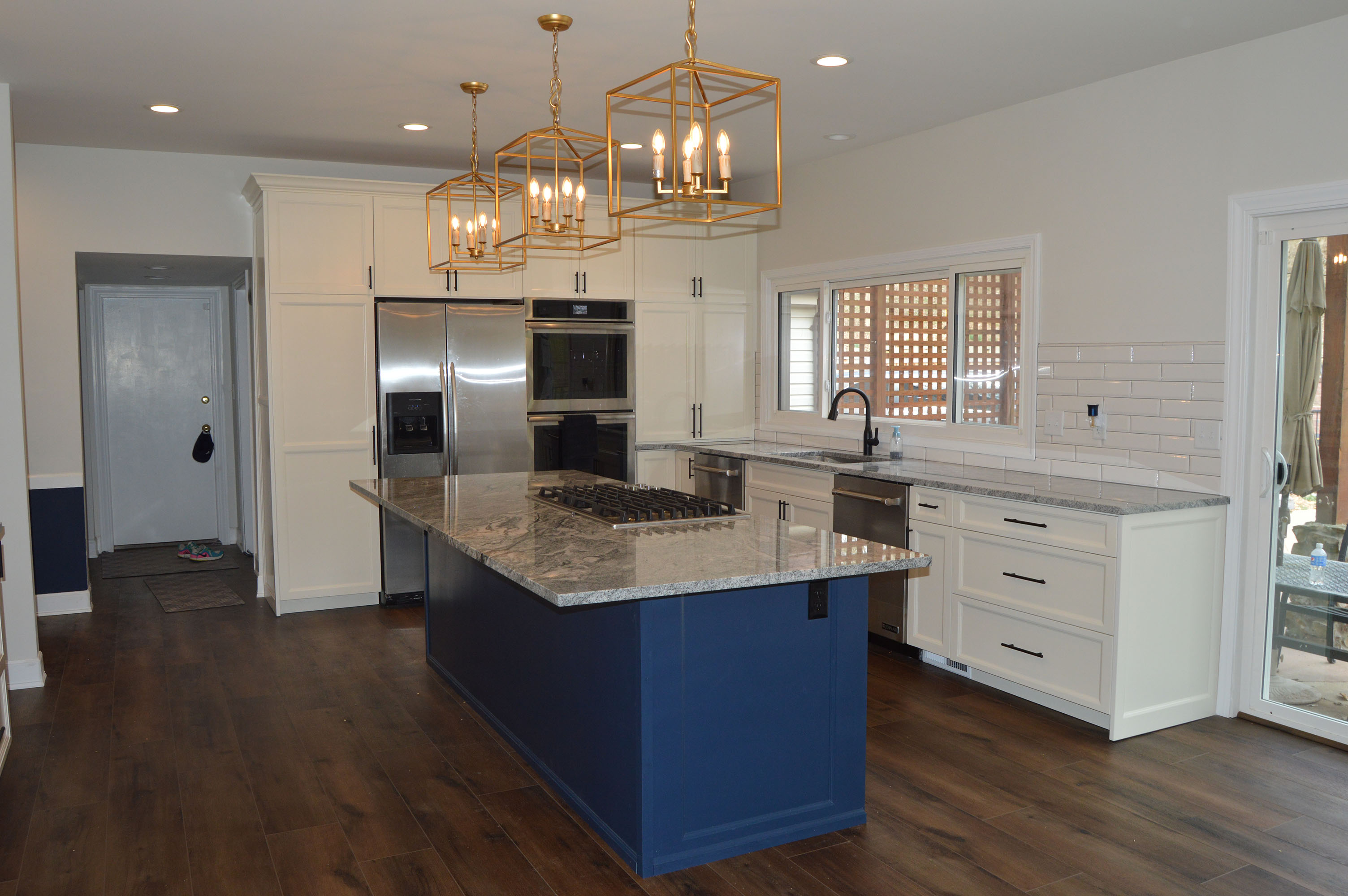 Kitchen renovation featuring blue island centerpiece - Professional Wood Interiors